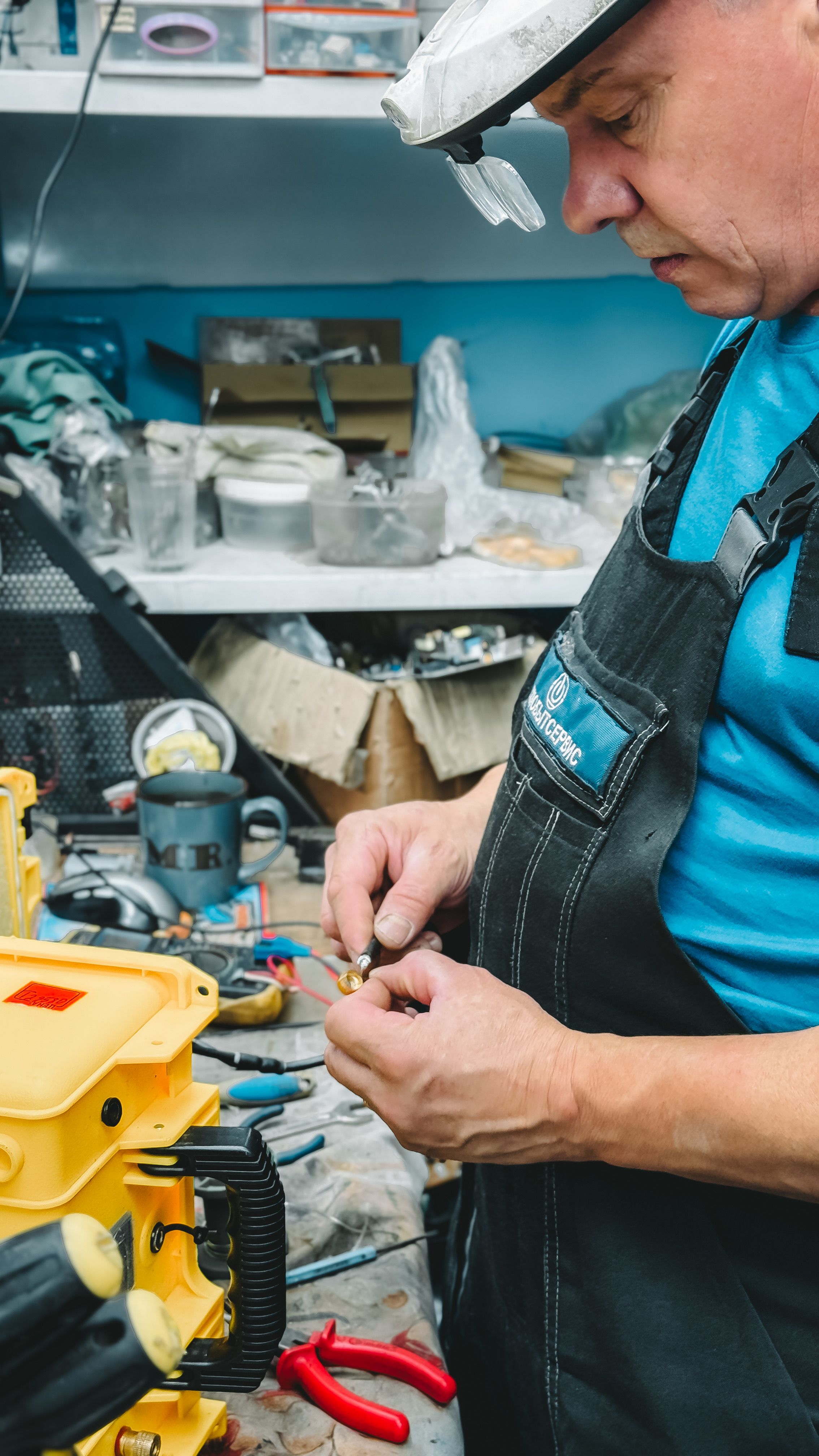 Appliance repair technician fixing a washing machine in Dammam