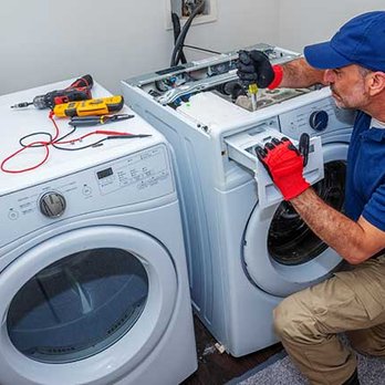 Baba Repairs technician working on an appliance in Dammam